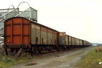 Vans await their fate on the other side of the line from the former Perth MPD. Curiously this footbridge led to the unfenced trackbed on this side at the time.<br><br>[Ewan Crawford //1988]