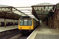 DMU for the south rests in the southbound bay platforms at Perth in the original station trainshed.<br><br>[Ewan Crawford //1988]