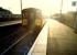 Glasgow bound, a train comes out of the sun at Stevenston.<br><br>[Ewan Crawford //1987]
