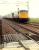 Glasgow train approaches Cove level crossing.<br><br>[Ewan Crawford //1988]