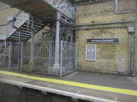 <h4><a href='/locations/W/Woolwich_Dockyard'>Woolwich Dockyard</a></h4><p><small><a href='/companies/N/North_Kent_Railway'>North Kent Railway</a></small></p><p>Woolwich Dockyard, eastbound platform, seen from a South Eastern service to Cannon Street via Greenwich, on 15th July 2021. This station was also opened with the North Kent Line on 30th July 1849. Only the original walls remain, all the Victorian buildings were demolished circa mid 1970s and replaced by the usual ghastly bus stop style waiting shelters. 135/189</p><p>15/07/2021<br><small><a href='/contributors/David_Bosher'>David Bosher</a></small></p>