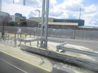 <h4><a href='/locations/S/Silvertown'>Silvertown</a></h4><p><small><a href='/companies/N/North_Woolwich_Railway'>North Woolwich Railway</a></small></p><p>View from class 345 unit on an Elizabeth Line service from Paddington to Abbey Wood, now on the alignment of the former North Woolwich line, just emerged from the revived Connaught Tunnel and passing the site of Silvertown station, on the First Day of Service, Tuesday, 24th May 2022. The new line utilises the old North Woolwich line from Custom House to just west of the old North Woolwich terminus where it descends into new tunnels to pass beneath the Thames to Woolwich and Abbey Wood. Despite industry and new housing here in Silvertown, no Elizabeth Line station has been provided but nearby is London City Airport station on the DLR's Woolwich Arsenal branch. 46/51</p><p>24/05/2022<br><small><a href='/contributors/David_Bosher'>David Bosher</a></small></p>