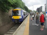 <h4><a href='/locations/G/Galashiels'>Galashiels</a></h4><p><small><a href='/companies/B/Borders_Railway_Network_Rail'>Borders Railway (Network Rail)</a></small></p><p>170434, with 170415, arriving to a reasonable-sized crowd of waiting passengers at its first port-of-call at Galashiels with the 13.23 (ex-13.19 from Tweedbank) Borders Line service to Edinburgh Waverley, on Friday, 17th June 2022. At the south end of this station, on the right  in the distance across the intervening road, is the bus station labelled as Galashiels Interchange and offering onward transportation to now railway-less towns like Peebles, Selkirk, Melrose and Hawick. However, there is no direct interchange between this and the rail station, passengers having to cross the road on the level to get from one to the other. 20/20</p><p>17/06/2022<br><small><a href='/contributors/David_Bosher'>David Bosher</a></small></p>