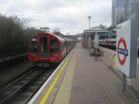 <h4><a href='/locations/N/North_Acton'>North Acton</a></h4><p><small><a href='/companies/E/Ealing_and_Shepherds_Bush_Railway'>Ealing and Shepherd's Bush Railway</a></small></p><p>LUL 1992 stock train, on a Central Line service to Epping, departing from North Acton on 9th February 2019. The 1904 GWR cut-off line to Birmingham and the site of the GWR's North Acton station, closed in 1947, are on the left but obscured by the bushes. 21/30</p><p>09/02/2019<br><small><a href='/contributors/David_Bosher'>David Bosher</a></small></p>