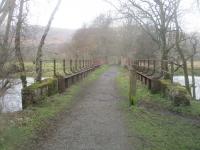 <h4><a href='/locations/K/Killin_Viaduct'>Killin Viaduct</a></h4><p><small><a href='/companies/K/Killin_Railway'>Killin Railway</a></small></p><p>View looking north-east from just past the site of Killin station towards Loch Tay, on 13th March 2019. Though Killin remained open until 1965, served from Killin Junction on the Callendar & Oban Line that closed at the same time, the section of line from Killin to Loch Tay lost its passenger service in 1939 but the line was retained until the end of the Killin service to give access to the locomotive shed at Loch Tay. 29/40</p><p>13/03/2019<br><small><a href='/contributors/David_Bosher'>David Bosher</a></small></p>
