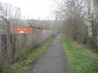 <h4><a href='/locations/K/Killin_2nd'>Killin [2nd]</a></h4><p><small><a href='/companies/K/Killin_Railway'>Killin Railway</a></small></p><p>The site of the small goods yard at Killin (on left), closed in 1965, looking north along the trackbed towards Loch Tay, on 13th March 2019. Now a council-run depot with no visible signs of the railway. This view, with the station site behind the camera, is a very sad comparison with historical pics of Killin station when the line was running. 28/40</p><p>13/03/2019<br><small><a href='/contributors/David_Bosher'>David Bosher</a></small></p>