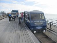 <h4><a href='/locations/S/Southend_Pier_Pier_Head'>Southend Pier [Pier Head]</a></h4><p><small><a href='/companies/S/Southend_Pier_Railway'>Southend Pier Railway</a></small></p><p>Southend Pier Railway train 'Sir William Heygate' at Pier Head station, on 29th August 2022. This is the survivor of the two 3ft. gauge diesel trains introduced when the line reopened in 1986 after an eight year closure and was running on this day, even though I was expecting to ride in one of the new trains delivered in 2021, one of which was alas standing 'Not in Service' at Shore station after it was discovered they needed modifications. 11/12</p><p>29/08/2022<br><small><a href='/contributors/David_Bosher'>David Bosher</a></small></p>