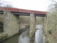 <h4><a href='/locations/S/Stubbins'>Stubbins</a></h4><p><small><a href='/companies/E/East_Lancashire_Railway'>East Lancashire Railway</a></small></p><p>View from East Lancashire Railway train approaching the disused Stubbins station, on 5th April 2016. Alder Bottom viaduct, crossing the River Irwell, is on the abandoned main line that diverged at Stubbins to Accrington via Helmshore but closed in 1966. 8/46</p><p>05/04/2016<br><small><a href='/contributors/David_Bosher'>David Bosher</a></small></p>