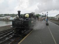 <h4><a href='/locations/P/Porthmadog_Harbour_FR'>Porthmadog Harbour [FR]</a></h4><p><small><a href='/companies/F/Festiniog_Railway'>Festiniog Railway</a></small></p><p>'Fairlie' locomotive 'Earl Meirionnydd', dating from 1979, waiting to depart from Porthmadog Harbour station with a Ffestiniog Railway train to Blaenau Ffestiniog on 22nd May 2016.   The first double-bogied articulated steam locomotives, known as 'Fairlies' after their designer, Robert Francis Fairlie (1831-1885) were introduced to the Ffestiniog Railway in 1869.   Constructed with swivelling power bogies, they enable longer trains to be hauled without increasing manpower costs and have long boilers with tall chimneys at both ends, giving them a very striking appearance.   The FR is still building 'Fairlies' today and some can now be seen working as far afield as Australia and USA.   This photo was taken while I was waiting to have my first ever ride on the Welsh Highland Railway to Caernarfon; I travelled on the FR to Blaenau Ffestiniog the following day. 17/75</p><p>22/05/2016<br><small><a href='/contributors/David_Bosher'>David Bosher</a></small></p>