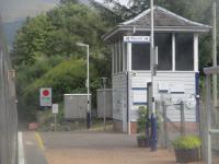 <h4><a href='/locations/T/Taynuilt'>Taynuilt</a></h4><p><small><a href='/companies/C/Callander_and_Oban_Railway'>Callander and Oban Railway</a></small></p><p>The signal box at Taynuilt, seen from a service from Oban to Glasgow Queen Street, on 14th September 2022. One of the better-used intermediate stations on the line, the crossing loop was changed to right-hand running in 1987. 22/23</p><p>14/09/2022<br><small><a href='/contributors/David_Bosher'>David Bosher</a></small></p>