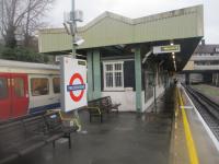 <h4><a href='/locations/P/Preston_Road'>Preston Road</a></h4><p><small><a href='/companies/K/Kingsbury_and_Harrow_Railway_Metropolitan_Railway_and_Metropolitan_and_St_Johns_Wood_Railway_Joint'>Kingsbury and Harrow Railway (Metropolitan Railway and Metropolitan and St John's Wood Railway Joint)</a></small></p><p>Preston Road, Metropolitan Line, looking south with a train to Aldgate on the left, on 31st December 2022. This line was opened by the Metropolitan on 2nd August 1880, but there was no station here until Preston Road for Oxendon Halt was opened, on the opposite side of the road bridge in the background, on 21st May 1908. It was resited during 1931/32, the south side of the island coming into use on 22nd November 1931 and the north  on 3rd January 1932. Presumably, between those two dates, southbound trains continued to serve the 1908 halt of which no trace remains. 15/21</p><p>31/12/2022<br><small><a href='/contributors/David_Bosher'>David Bosher</a></small></p>