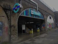<h4><a href='/locations/S/Shadwell'>Shadwell</a></h4><p><small><a href='/companies/B/Blackwall_Railway'>Blackwall Railway</a></small></p><p>One of two entrances to Shadwell DLR station, the most easterly, beneath the historic London & Blackwall Railway viaduct of 1840, on 25th January 2023. This stands on the site of the old Shadwell & St. Georges East station, closed as a war economy in 1941 and never reopened, but whose boarded-up entrance still stands further east. <a href='/img/73/355/index.html'>73355</a> 183/189</p><p>25/01/2023<br><small><a href='/contributors/David_Bosher'>David Bosher</a></small></p>