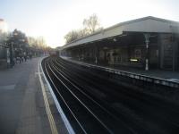 <h4><a href='/locations/E/East_Putney'>East Putney</a></h4><p><small><a href='/companies/W/Wimbledon_and_Putney_Line_London_and_South_Western_Railway'>Wimbledon and Putney Line (London and South Western Railway)</a></small></p><p>East Putney, looking towards Wimbledon, on 15th January 2023. The Wimbledon & Putney line was opened by the LSWR on 3rd June 1889 from Wimbledon to a connection with their Richmond line at Point Pleasant junction, west of Wandsworth Town. The LSWR also provided a spur from this station, with its own platforms (seen here), across the Thames to an end-on junction with the District Line at Putney Bridge which enabled these trains to be extended to Wimbledon with running powers but no LSWR trains ever used this connection. Passenger services between Wimbledon and Waterloo via Point Pleasant were withdrawn by the Southern on 5th May 1941 but the line remained in main line ownership until 1st April 1994 when it was transferred to London Transport and is still used by National Rail for empty stock workings and occasional passenger diversions, as at the time of the Clapham Junction rail crash in 1988. The original buildings on the left were destroyed in a fire some years ago. 128/138</p><p>15/01/2023<br><small><a href='/contributors/David_Bosher'>David Bosher</a></small></p>