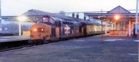 Heading for the Western Highlands at Dumbarton Central in 1988. Sprinters were to replace 37s shortly afterwards.<br><br>[Ewan Crawford //1988]