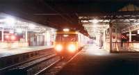 A 303 in the dark at Dumbarton Central.<br><br>[Ewan Crawford //1988]