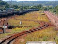 Perth New Yard looking north. Redundant wagon storage, old turntable, grasslined sidings and the mainline to Inverness.<br><br>[Ewan Crawford 13/07/2003]