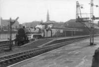 73009 pulls out of G&SW platforms at Gilmour Street with Glasgow train.<br><br>[John Robin 06/08/1963]