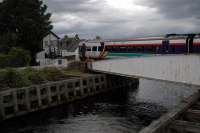 Dead slow over the swing bridge at Clachnaharry. Rain coming ...<br><br>[Ewan Crawford //2004]