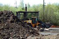 A digger menaces the old control cabin for the High Street Goods Yard. The whole area is being redeveloped and this building cannot have long left to go. Much of this work seems to involve a huge amount of earthmoving.<br><br>[Ewan Crawford 05/05/2006]