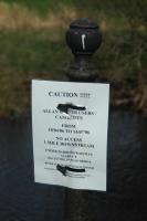 Sign on the River Allan at Ashfield to warn canoes about scaffolding on Barbush Viaduct downstream.<br><br>[Ewan Crawford 06/05/2006]