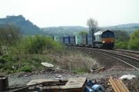 4A11 the Grangemouth-Aberdeen freight approaches Bridge of Allan from the south. Stirling Castle is in the background on the left. In the foreground is stuff left from track maintenance.<br><br>[Ewan Crawford 06/05/2006]