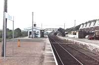 Dingwall in August 1982.The engine shed and other railway buildings beneath the footbridge on the right have been demolished and replaced by flats.<br><br>[John Gray /08/1982]