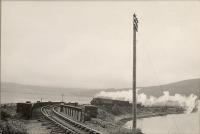 H.R. 0.4.4T 55051 with a train from Dornoch about to leave the causeway before crossing the bridge over Loch Fleet narrows to reach The Mound Junction.<br><br>[G H Robin collection by courtesy of the Mitchell Library, Glasgow 03/07/1950]