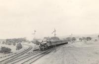 Carstairs based Fairburn 2-6-4T 42173 about to run through Poniel Junction, South Lanarkshire, in July 1953 westbound towards Muirkirk. Turning off to the north is the line to Alton Heights and Lesmahagow.<br><br>[G H Robin collection by courtesy of the Mitchell Library, Glasgow 25/07/1953]