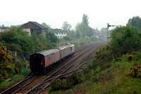 Southbound empty parcel vans from Inverness to Mossend. The last splitting distant in Britain is in the background showing the train will take the line to Carmuirs West. Larbert box is also in the distance.<br><br>[Ewan Crawford 12/05/2006]