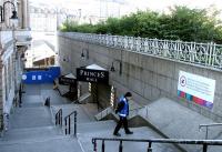 <I>Hmmphhh!!!</I> Sunday morning guard duty! With the Waverley Steps entrance to the station closed off, a temporary entrance to Waverley has been opened up through Princes Mall. View from Princes Street on 14 May 2006. [See image 9657]<br><br>[John Furnevel 14/05/2006]