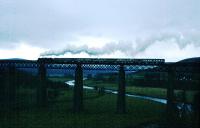 Black five 44871 is seen in silhouette crossing Findhorn Viaduct on a miserable wet morning in November 1995.<br><br>[John Gray /11/1995]