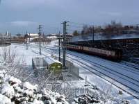Newcastle - Stranraer train passes King Edward South Junction.<br><br>[Ewan Crawford 28/02/2004]