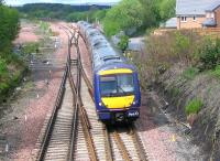 A Glasgow - Edinburgh train passing the modified layout at Polmont Junction in May 2006.<br><br>[John Furnevel 15/05/2006]