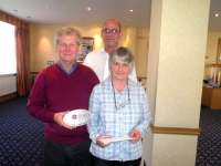 Belinda and Alan Renwick of Station Lodge, Tulloch, with their HITRANS award, photographed with Robert Samson following the presentation on 10 May 2011. [See news item]  <br><br>[First ScotRail 10/05/2011]