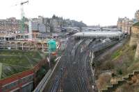 Changes underway at the east end of Waverley in January 2006. At the bottom left New Street bus depot is now boarded up ready for demolition, while across the road the new Edinburgh Council headquarters is under construction. In the background, work is in progress on the IECC extension to the Edinburgh signalling centre [see image 9510].<br><br>[John Furnevel 14/01/2006]