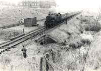 Wemyss Bay - Glasgow train approaching west end in pouring rain. Cartsburn Twin Tunnels.<br><br>[G H Robin collection by courtesy of the Mitchell Library, Glasgow 31/08/1963]