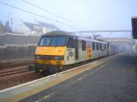 Following the split of the Glasgow and Edinburgh portions of the Sleeper at Carstairs, 90027 prepares to leave for Waverley with the rear 7 coaches. <br><br>[John Furnevel 06/06/2006]