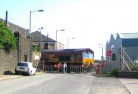 EWS 66205 brings a train of imported coal through the Albert Road gate out of Leith docks and over the level crossing into Leith South yard on 7 June 2006.<br><br>[John Furnevel 07/06/2006]