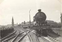 Class 2 4-6-0 40621 propelling empty stock for the 7.10pm Kilmarnock train from Saltmarket Junction into St Enoch station on 11 June 1957.<br><br>[G H Robin collection by courtesy of the Mitchell Library, Glasgow 11/06/1957]