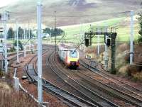 A Virgin Voyager runs south through the Abington loops in December 2002.<br><br>[John Furnevel 07/12/2002]