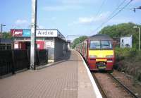 Looking west along the through platform at Airdrie station in June 2006 with a Drumgelloch - Helensburgh service about to leave.<br><br>[John Furnevel 11/06/2006]