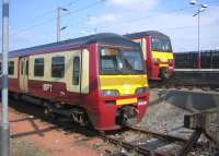 Emus stabled in the siding and bay platform at Airdrie on Sunday 11 June 2006.<br><br>[John Furnevel 11/06/2006]