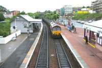 Coal empties north through Inverkeithing in June 2006. Inverkeithing South Junction and the branch down to Rosyth Dockyard can be seen towards the rear of the train. <br><br>[John Furnevel 19/06/2006]