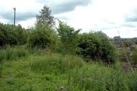 Looking to the Barrhead lines South Side station from the south. The derelict Gushetfaulds Freightliner depot is on the right.<br><br>[Ewan Crawford 20/06/2006]