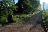 Looking west at Blackgrange level crossing. Welded rail lies to the right.<br><br>[Ewan Crawford 24/06/2006]