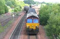 66021 takes a train of empties out of Halbeath sidings and heads south for the Forth Bridge in June 2006.<br><br>[John Furnevel /06/2006]