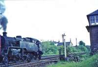 Fireman of 80046 collects the tablet for the single line to East Kilbride. Donald MacKay is the signalman.<br><br>[John Robin 03/06/1965]