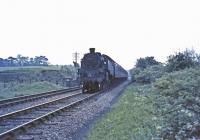 80063 passing the site of Clarkston East Jct with emcars from East Kilbride<br><br>[John Robin 28/05/1965]