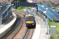 A Fife circle train pulls away from Queen Margaret station, Dunfermline, in June 2006 heading north.<br><br>[John Furnevel 13/06/2006]