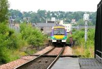 A down train passing the remains of Perth Princes Street station in the summer of 2006, some forty years after closure. Seen from the west end of the Tay Viaduct. [See image 34217]<br><br>[John Furnevel 15/07/2006]